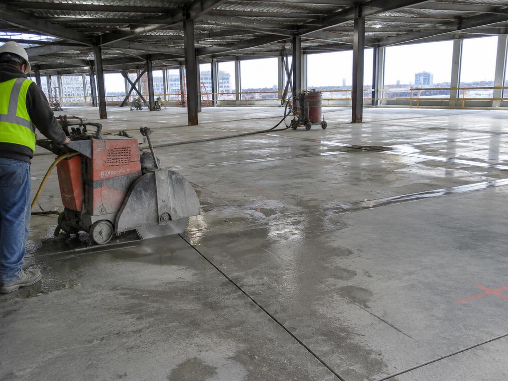 Slab saw cutting lines in a commercial building concrete floor